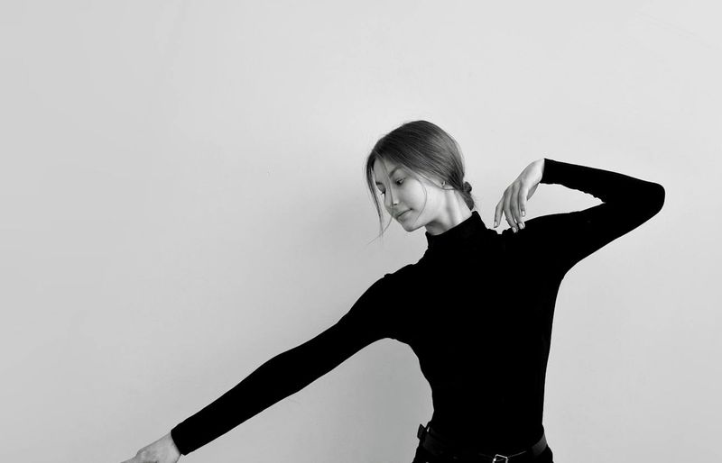 Person in a dynamic yoga pose showing fluidity of movement.